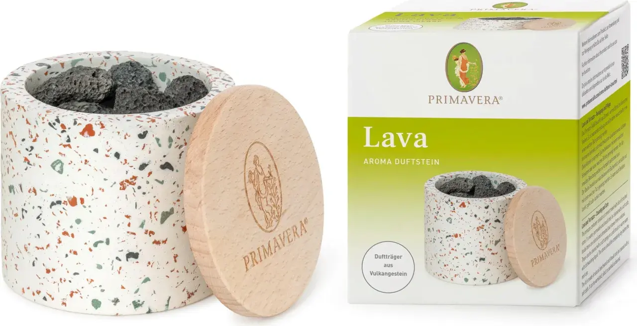 En doftsten av lavasten i en terrakottakruka med trälock. Lavastenens egenskaper gör den perfekt för aromaterapi.
